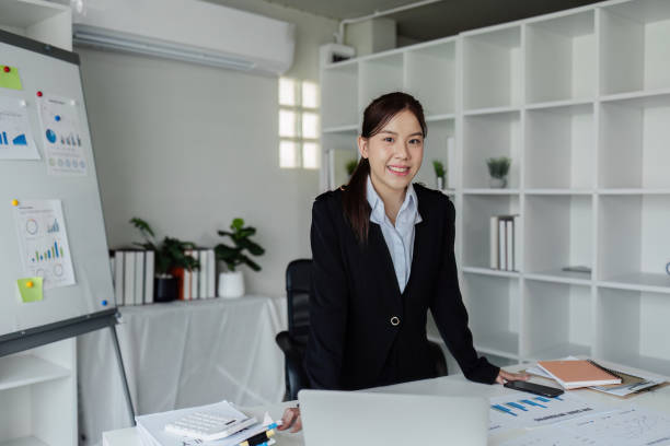 istock successful businesswoman standing and looking confident at camera 2129758020