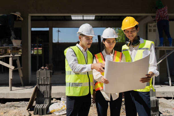 istock team engineer, foreman, architect meeting for colleagues discussing and checks construction blueprints at onsite 2129763260