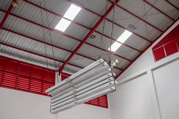 Medan, Sumatra, Indonesia - January 16th 2024:  Large industrial chandelier under the roof in a garage