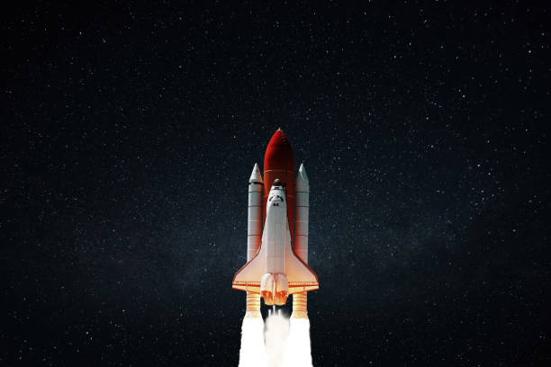 istock New space shuttle rocket with blast successfully takes off into the night starry sky. Spaceship launched into outer deep space with stars 2129771118