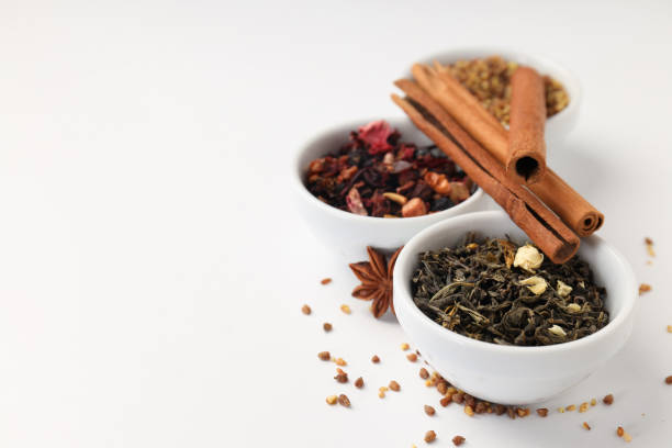 Concept of cooking tea with different types of tea on white background