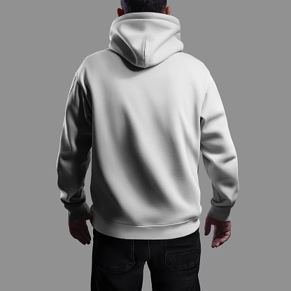 Mockup of a white oversized hoodie on a dark-haired man, back view. Fashionable wide clothing template for design, print, branding. Sweatshirt with hood, cuffs, isolated on background with shadows