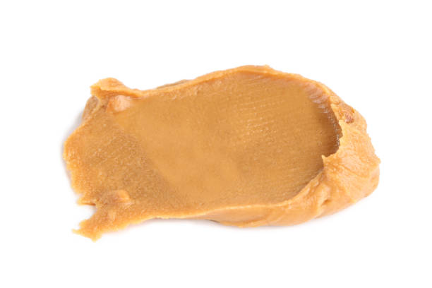 istock Peanut butter isolated on white background 2129814803