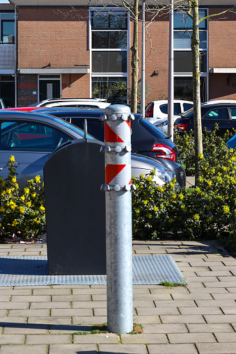 Steel pole with hooks for plastic waste collection every fortnight n Nieuwerkerk aan den IJssel
