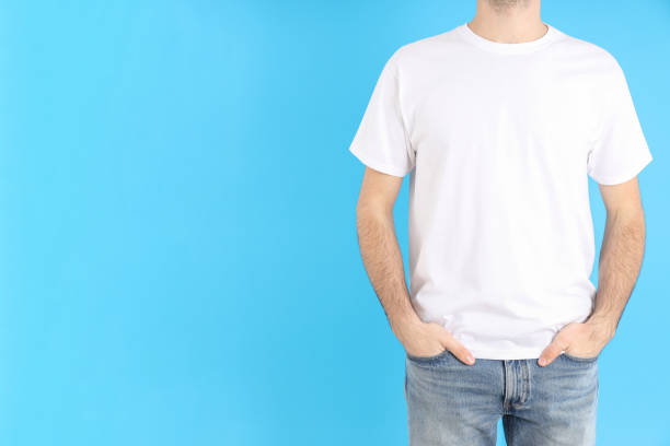 istock Man in blank white t-shirt on blue background 2129824334