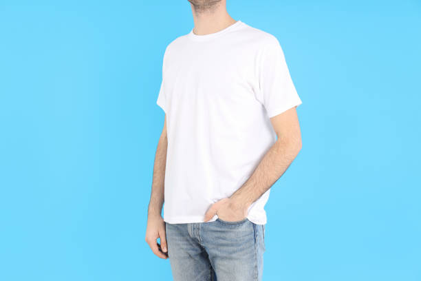 istock Man in blank white t-shirt on blue background 2129825405
