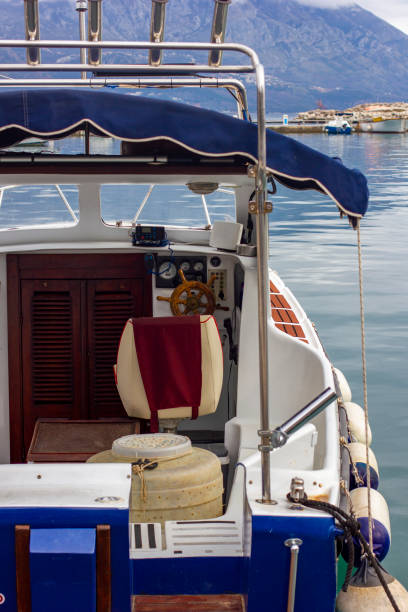 istock Yacht captain's helm and chair 2129833704