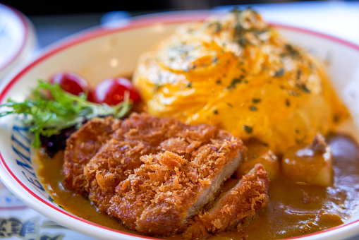Close-up of a delicious Japanese fried pork cutlet omurice rice dish