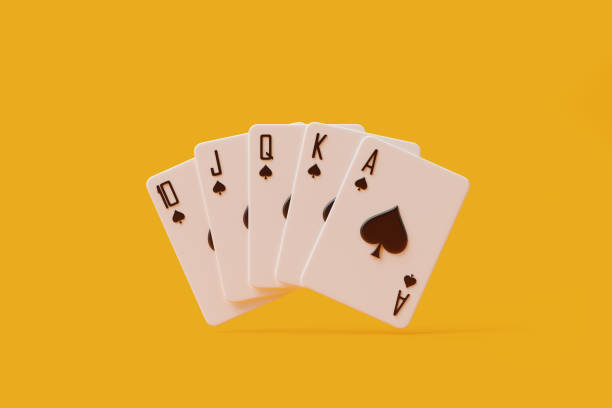 istock Royal Flush Hand on Yellow Background 2129850288