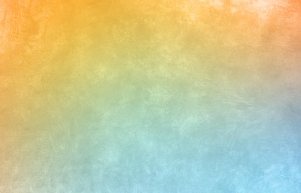 istock Colored yellow-blue gradient with concrete texture. Colorful cool background 2129876790