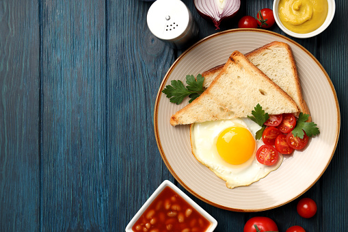 Concept of tasty breakfast on wooden background