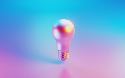 Red lightbulb illuminated by pink and blue lights on purple background. Horizontal composition.