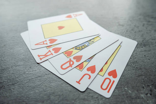 Hearts royal flush poker combination on grey background. Gambling