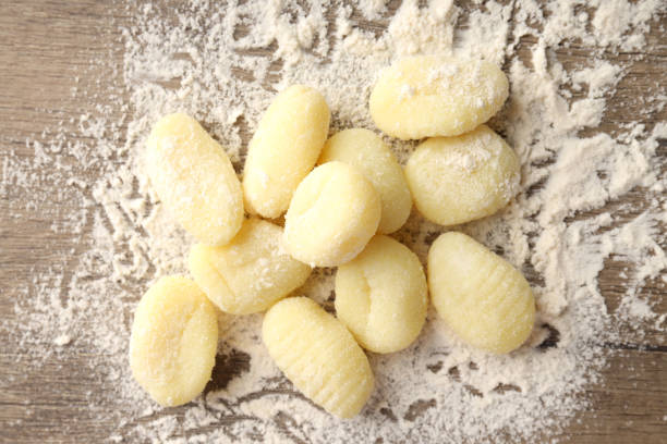 istock Raw potato gnocchi with flour, close up 2129895276