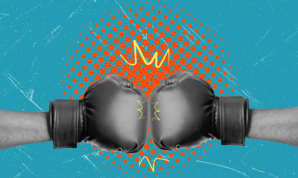 istock Creative image of a hand in boxing gloves on a blue background. 2129906406
