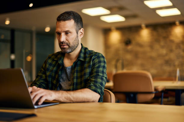istock Businessman working over the laptop, at the office, dressed casually. 2129917364