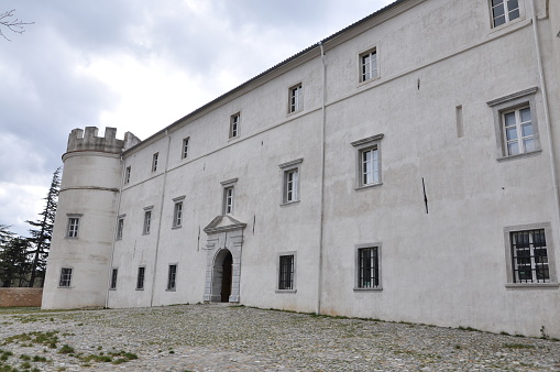 Exterior of the medival castle Zrinski-Frankopan with the tower and the blue sky.'Zrinski-Frankopan's castle inner courtyard of the medieval castle.Well in the inside courtyard of the medival castle
