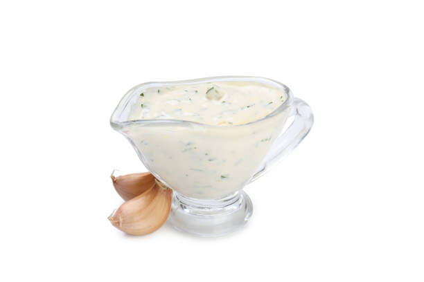 Garlic sauce and ingredients isolated on white background