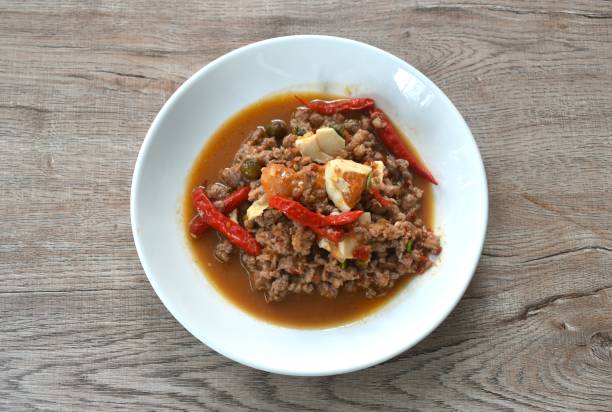istock spicy chop pork Thai chili pasted topping salty egg 2129949367