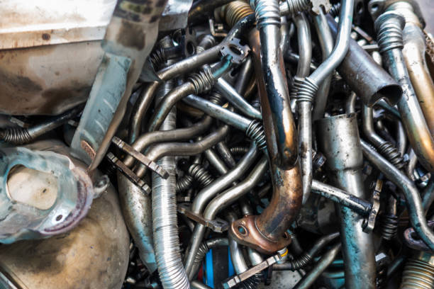 istock Old and rusty car parts in a junkyard 2129957866