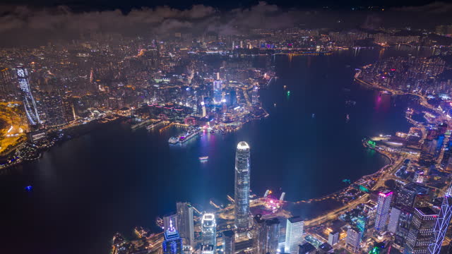High angle view hyper lapse over view Hongkong central financial district with harbour view in new sustainable smart city concept