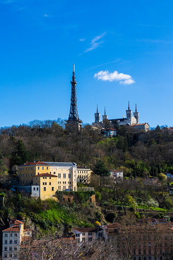 View of Fourvière hill, with its metallic tower and basilica, from Cour du Général Giraud in the Croix-Rousse district in Lyon