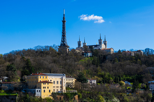 View of Fourvière hill, with its metallic tower and basilica, from Cour du Général Giraud in the Croix-Rousse district in Lyon