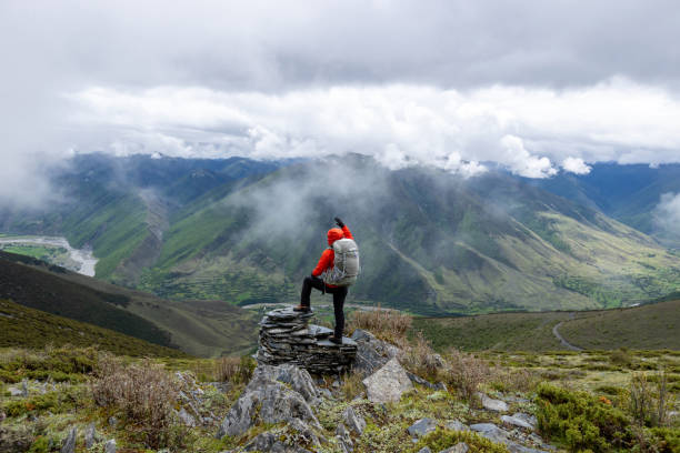 Hiking woman on high altitude mountain top
