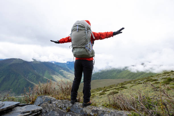 istock Hiking woman on high altitude mountain top 2130049719