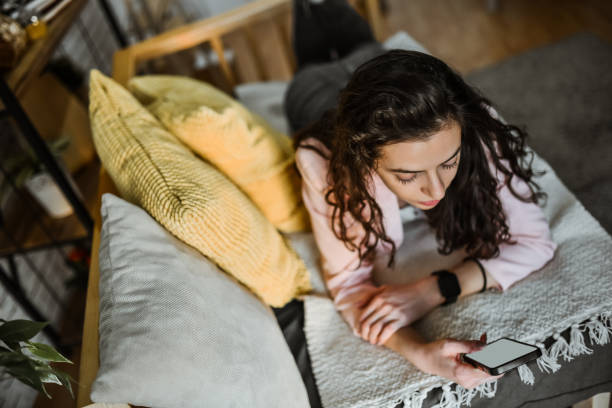 istock Female Scrolling Through Online Shopping Catalogue 2130116200