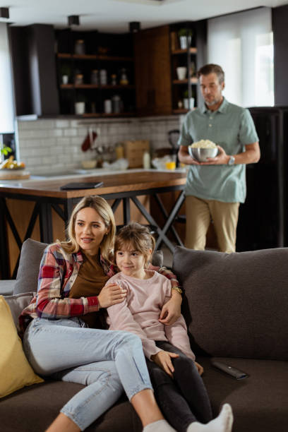 istock Family Movie Night: Engrossed in Thrilling Scenes at Home 2130142792