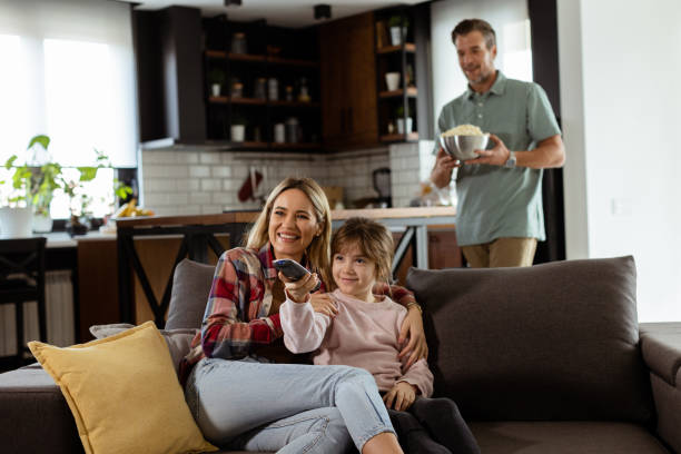 istock Family Movie Night: Engrossed in Thrilling Scenes at Home 2130142810