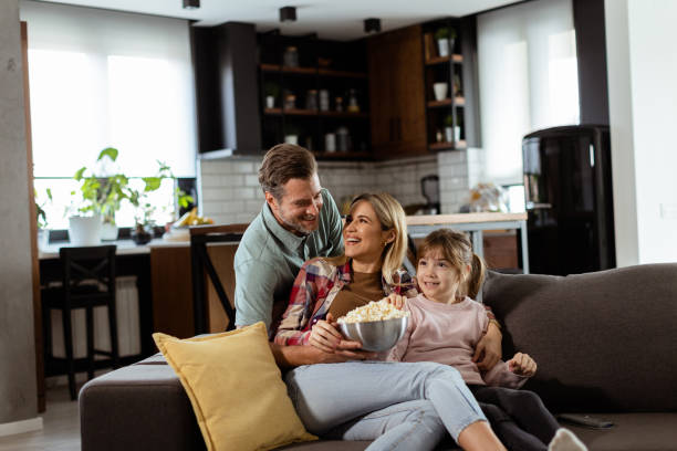 istock Family Movie Night: Engrossed in Thrilling Scenes at Home 2130142813