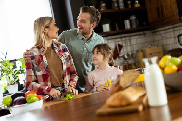 istock Family bonding during breakfast in a sunlit modern kitchen 2130144396