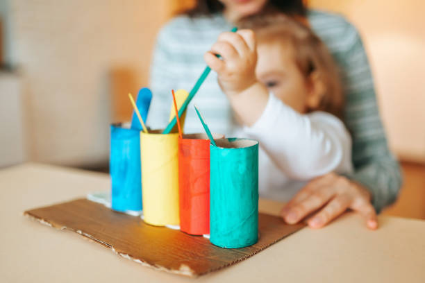 Close up front view materials on the Montessori system for classes with children at home. homeschooling early development concept. Young mother daughter little girl.
