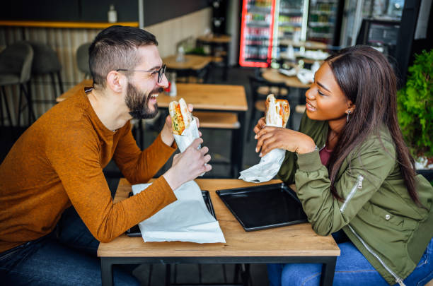 istock Couple eating in fast food restaurant 2130160964