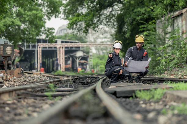 istock Engineers use blueprints for rail maintenance and troubleshooting to ensure safe train operations. 2130161474