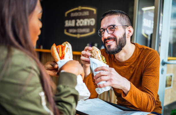 istock Friends eating in a fast food restaurant 2130167494