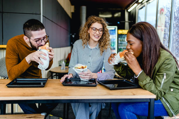 Friends enjoying lunch at a fast-restaurant
