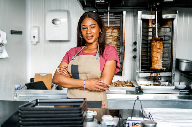 istock Woman working at a fast food restaurant 2130171690