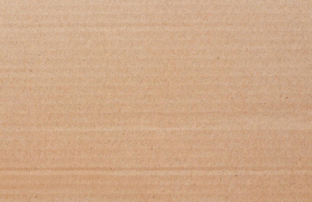 istock Cardboard sheet texture background, detail of recycle brown paper box pattern. 2130217042