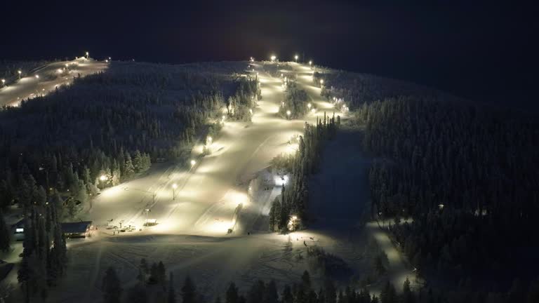 Aerial view around the night-lit slopes of Salla in Lapland, Finland