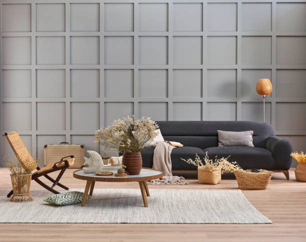 istock Grey room decorative wall background, dark blue sofa, middle table, blanket pillow style, vase of cotton flower and carpet, orange lamp, interior decoration. 2130233901