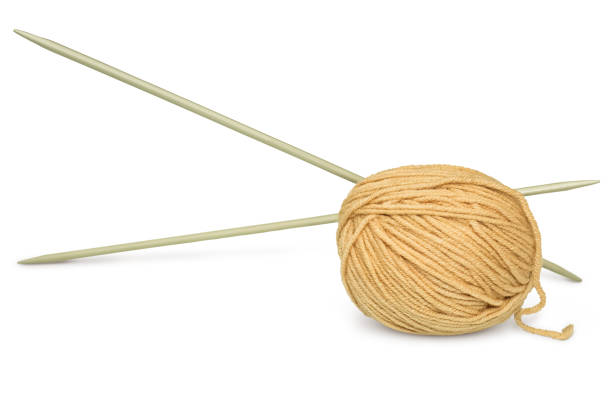 istock A skein of woolen thread with knitting needles. 2130267557
