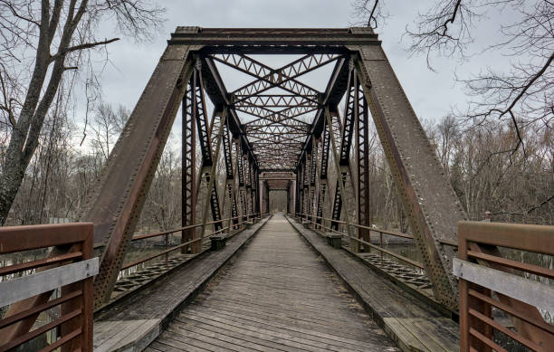 istock railway trestle bridge over wallkill river valley (springtown bridge in new paltz, new york) iron metal former railroad converted to rail trail and pedestrian path in hudson valley 2130305423
