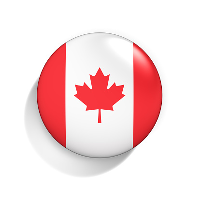 Canadian flag waving on the wind with blue sky and white clouds on the background, Quebec, Canada