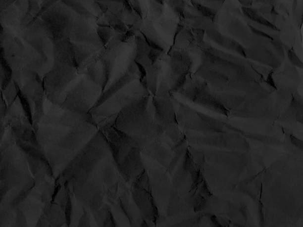 istock black wrinkled paper texture. crumpled paper 2130328230