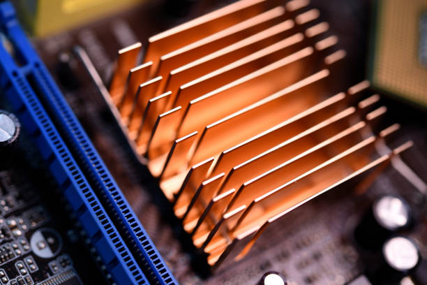 A copper radiator for cooling the chip on the computer board. Radio components.The computer's motherboard.