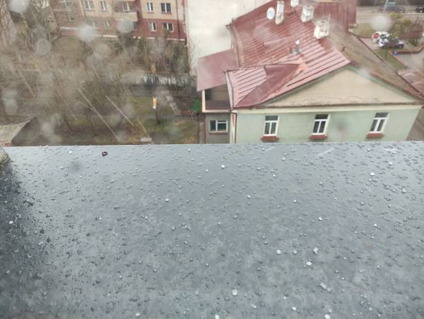 istock Snow crumbs fall on the windowsill 2130343011