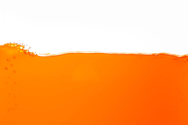 orange juice texture isolated white background,Close up bright orange juice texture for health and nature waves